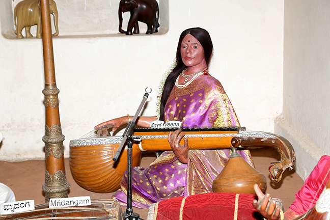 Woman playing veena Photograph of a wax sculpture of a woman playing the veena